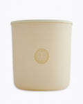 Beige candle with a logo on a white background