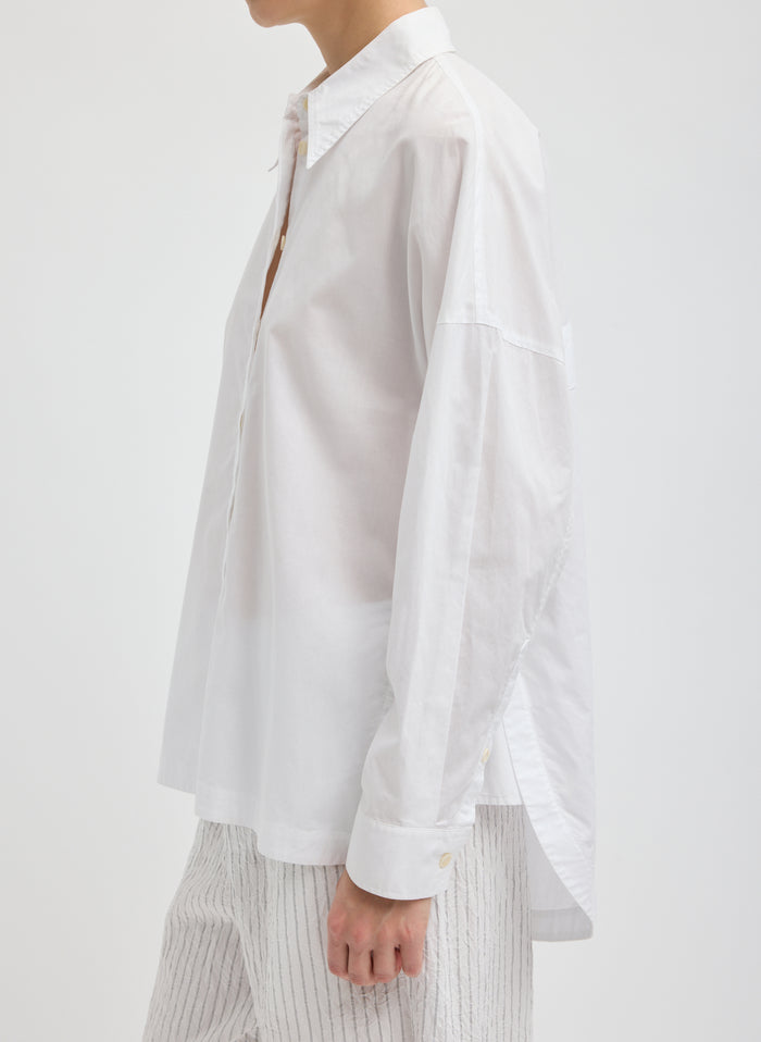 White Gabe Oversized Shirt - oversized button down, side view on model