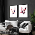 Contemporary living room with two framed floral pictures hanging above a white sofa against grey wall