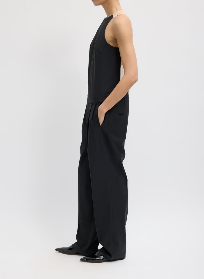 Black Recycled Tropical Wool Jumpsuit - sheer organza back, side view on model