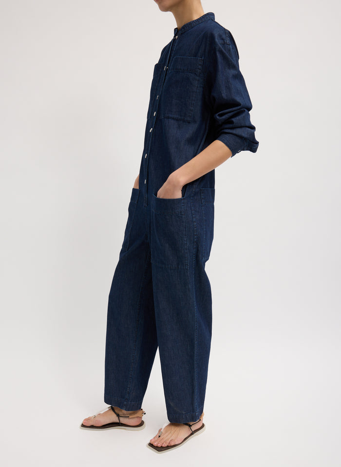 Dark Wash Summer Denim Jumpsuit - long sleeved, button up, side view on model